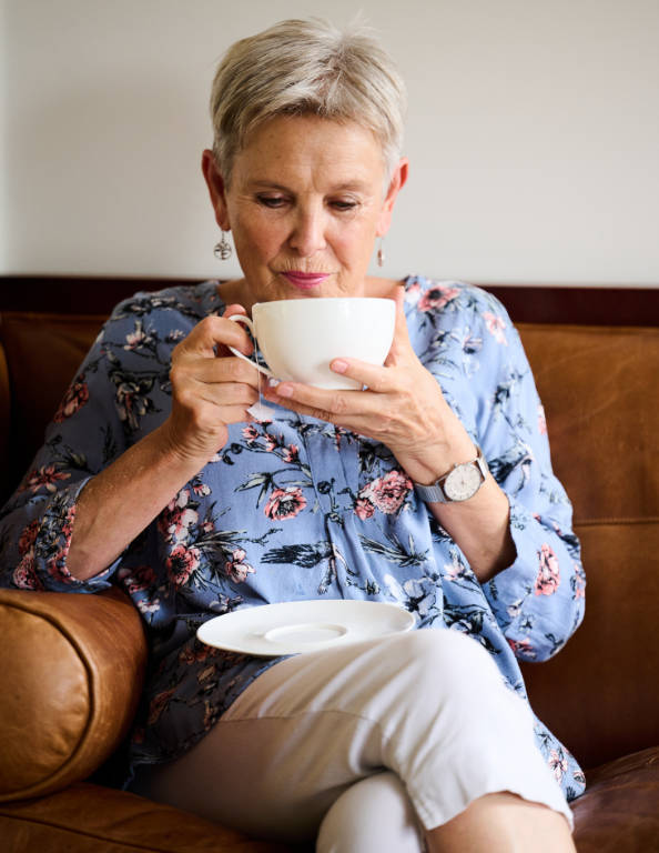lady drinking a cup of herbal tea